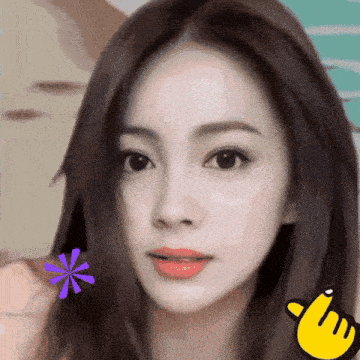 a close up of a woman 's face with a yellow finger pointing to the right
