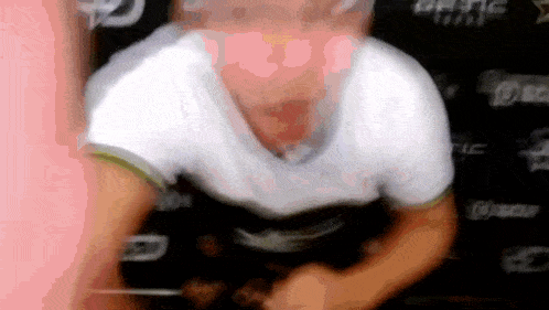 a blurry picture of a man 's face with the word optic on the bottom