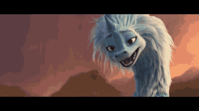 a close up of a cartoon dragon with a unicorn horn on its head
