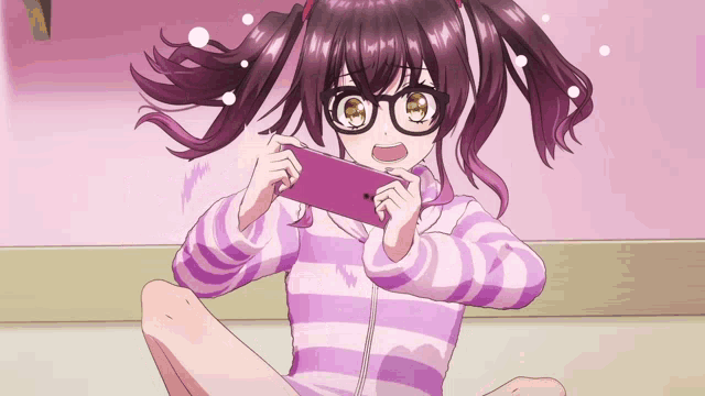 a girl with pigtails and glasses is holding a cell phone