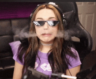 a woman wearing sunglasses and headphones is blowing smoke out of her mouth