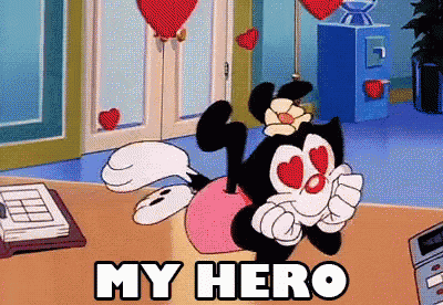 a cartoon character says " my hero " in front of a desk