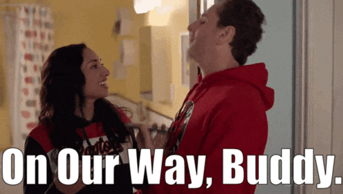 a man and a woman are standing next to each other with the words " on our way buddy " behind them