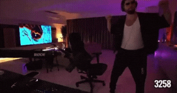 a man is standing in a room with the number 3258 on the bottom right