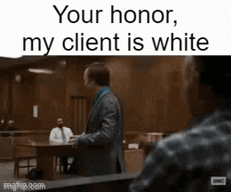 a man in a suit and tie is standing in a courtroom with the words " your honor my client is white "