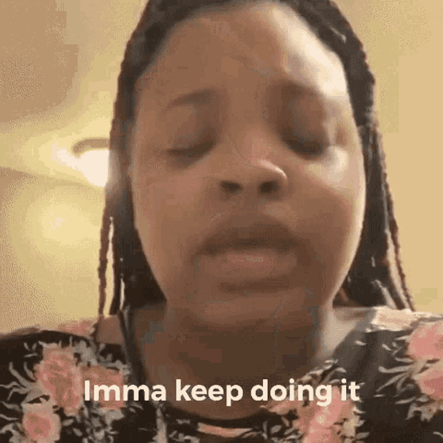a woman with dreadlocks is making a funny face and says `` imma keep doing it '' .