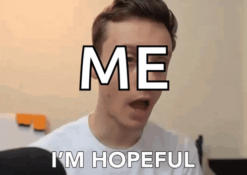 a man is making a funny face with the words `` me i 'm hopeful '' written on his face .
