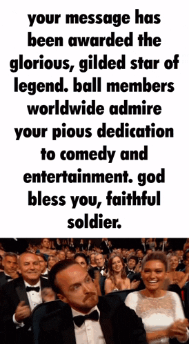 a man in a tuxedo is sitting in front of a crowd of people with a caption that says your message has been awarded