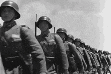 a black and white photo of a military parade