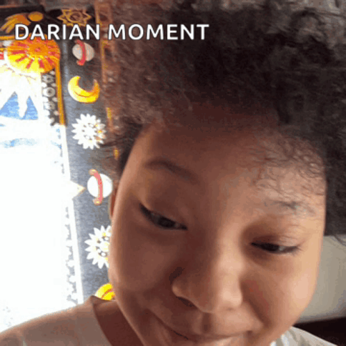 a close up of a child 's face with the words darian moment above