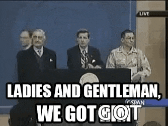 a group of men are standing behind a podium giving a speech .