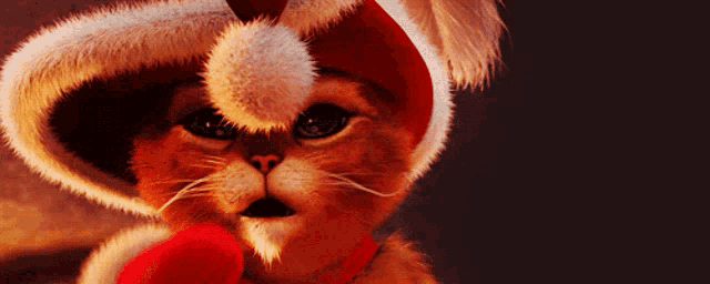 a cat wearing a santa hat and a bow tie