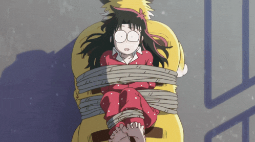 a girl in a red pajama top is tied to a yellow monster