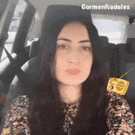 a woman sitting in a car with the name carmen nadales on the bottom right