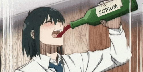 a person is drinking from a bottle that says copilum on it