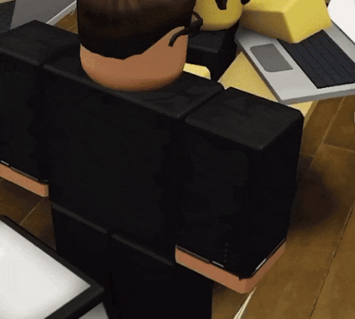 a cartoon character is sitting at a desk with a laptop on it