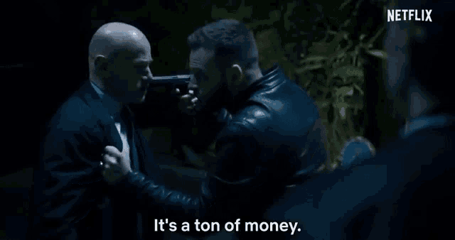 a man holding a gun says it 's a ton of money .