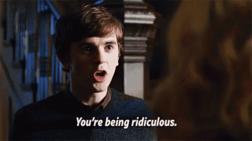 a young man is smiling and says you 're being ridiculous