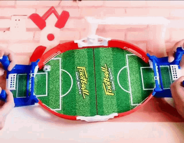 two people are playing a soccer game that says football