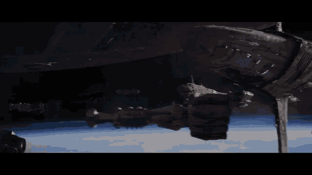 a large space ship is docked at a station in space