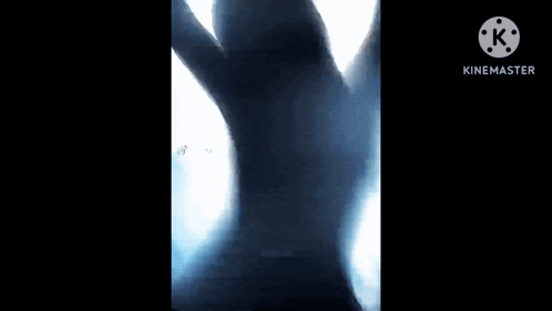 a silhouette of a person with their arms outstretched against a black background .