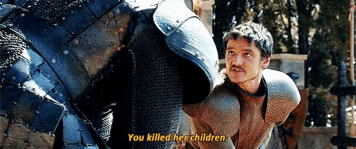 a man in armor says `` you killed her children '' while standing next to a man in armor .