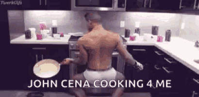 a shirtless man is kneeling on the floor in a kitchen holding a pan and a frying pan .
