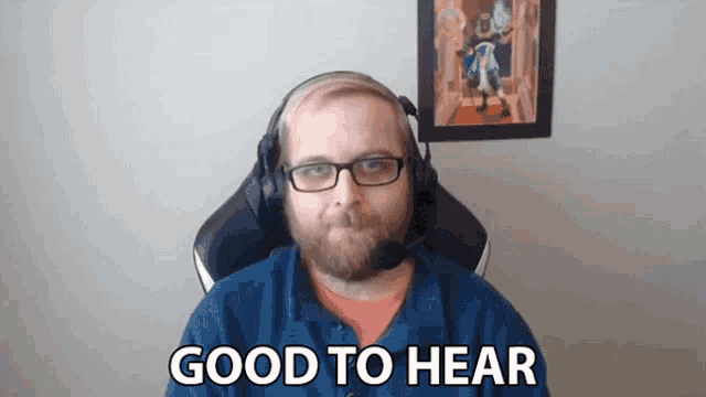a man wearing headphones and glasses is saying good to hear