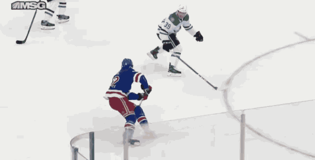 a hockey game is being played in front of a chase ad