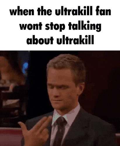 a man in a suit and tie is giving the middle finger to someone .