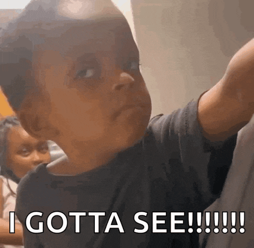 a little boy is making a funny face with the words i gotta see !!!