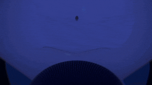 a close up of a blue anime character 's face