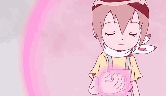 a girl with a scarf around her neck is holding something in her hands
