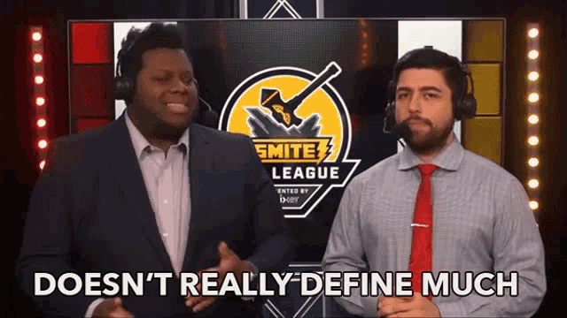 two men standing in front of a smite league sign