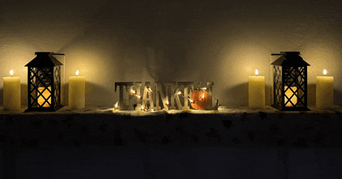 a mantle with candles and a sign that says " thank you "