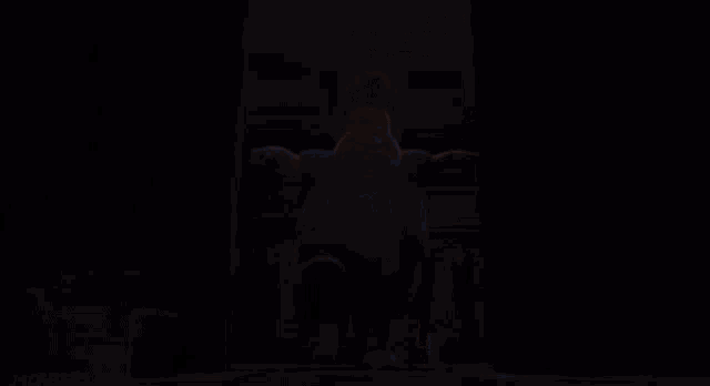 a blurry picture of a superhero with a cape
