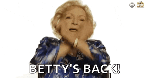 an elderly woman in a blue and white dress is saying betty 's back !