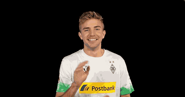 a man in a white shirt with a yellow stripe that says post