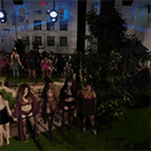 a blurry picture of a group of people standing in front of a building