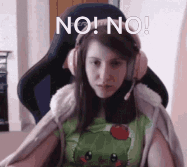 a woman wearing headphones is sitting in a chair with the words " no ! no ! " above her head