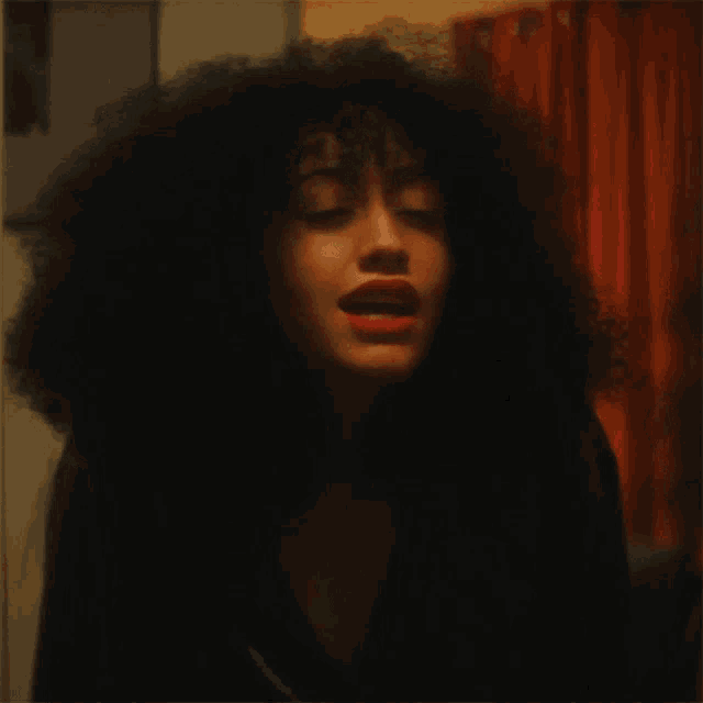 a close up of a woman 's face with red lips