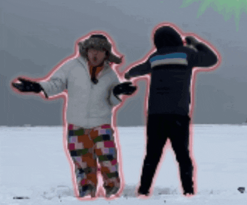 a couple of people standing in the snow with their arms outstretched