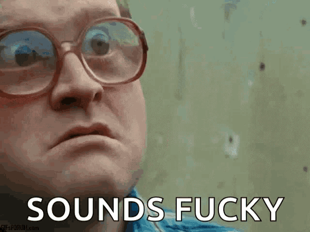 a man wearing glasses says " sounds fucky " in front of a wall