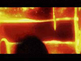 a red and yellow background with a black circle in the center