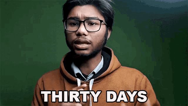 a man wearing glasses says thirty days