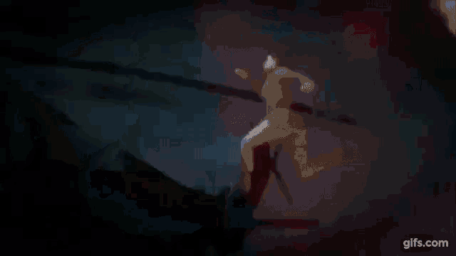 a glowing light is coming out of a dark cave in the night sky .