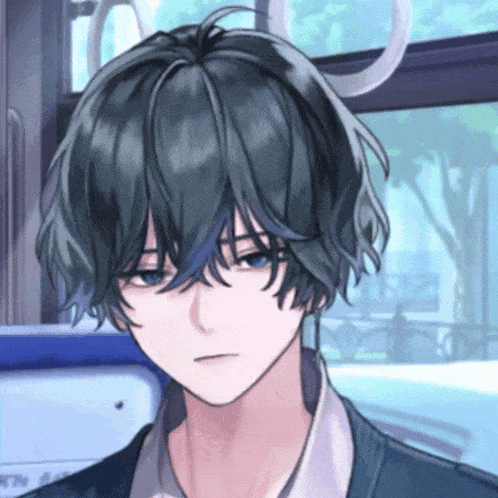 a close up of a boy 's face with a serious look on his face