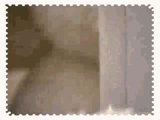 a postage stamp with a blurred image of a door