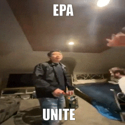 a man in a black jacket is standing in a room with the words epa unite above him