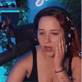 a woman wearing headphones and a tattoo on her arm